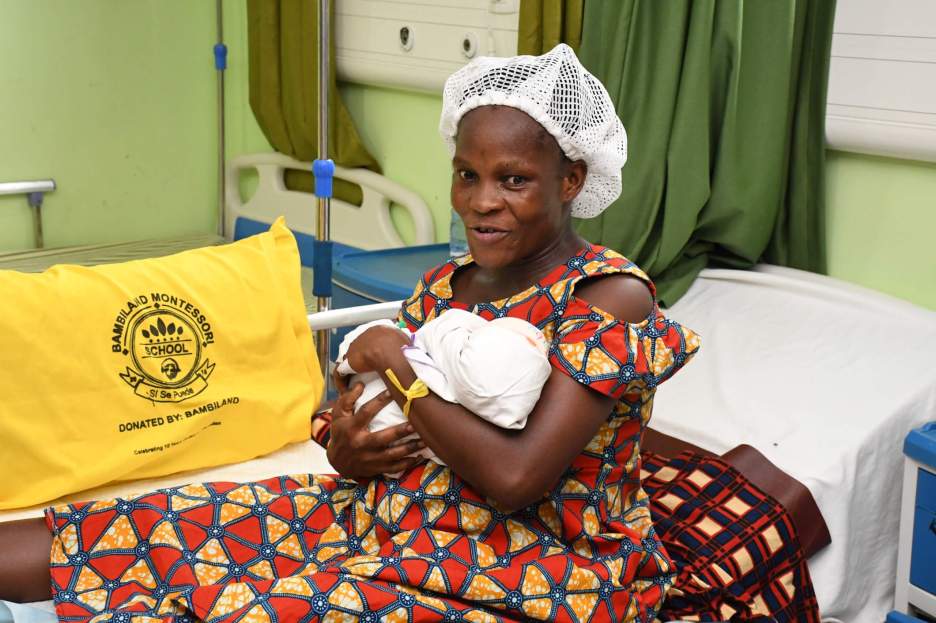 A mother Cradles newborn